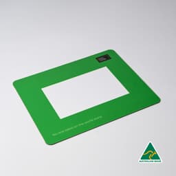 A green mouse mat featuring a central photo frame cut-out and a logo in one corner.