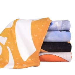 A stack of face washers in various colours including orange, blue, and black, featuring vibrant patterns.