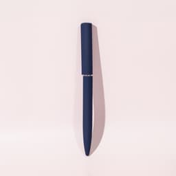 A blue ballpoint pen with a mirror finish, featuring a sleek design and a branding logo.