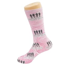 Pink dress sock featuring silhouetted figures and a logo, displayed on a sock mannequin.