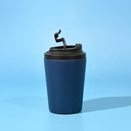 A drink bottle in navy blue with a black lid and a built-in straw, featuring a logo.