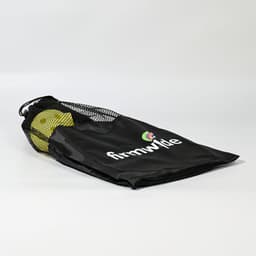 A black mesh carry bag containing yellow pickleballs, featuring a logo on the side.