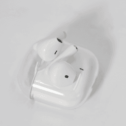 White noise cancellation earbuds in a clear case, featuring a simple design and a compact size.