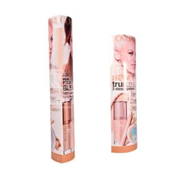 Two cylindrical cardboard displays featuring a cosmetics product, primarily in shades of peach and beige, with a branding logo.