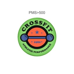 A green frisbee with a circular design featuring an orange barbell, stars, and the word "CrossFit".