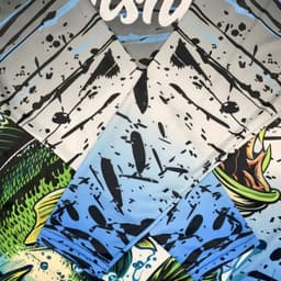 A collection of long sleeve fishing shirts in blue and grey with a fish and water pattern, featuring a logo.