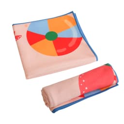 A microfibre beach towel in pastel colours, featuring a beach ball design, folded and rolled for compact storage.