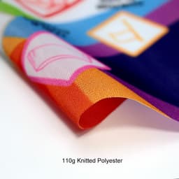 A close-up of a vibrant Body Flag featuring various colours and patterns, made of 110g knitted polyester.