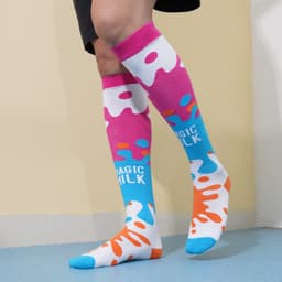 Knee-high socks featuring a vibrant pink, blue, and orange splash pattern with a logo.