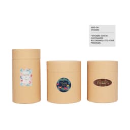 Three medium brown paper cylinder boxes with different colourful stickers on each. The boxes are stackable.