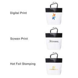 Three large black and white paper bags displayed, each showcasing different printing techniques and featuring a logo.
