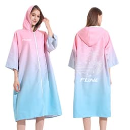 A hooded change towel in pink and light blue with a zip, featuring a logo and a tropical design on the back.