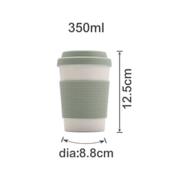 A bamboo fibre coffee cup in cream with a light green silicone lid and grip, measuring 350ml.