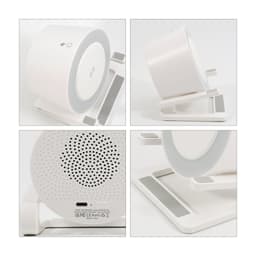 A white night light speaker with a wireless charging stand, featuring a circular design and a logo on the base.