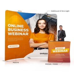 A C-shaped tension fabric display wall in orange and white with a model, promotional text, and a logo.