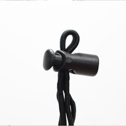 A black adjustable toggle stopper attached to a black cord, designed for securing items.