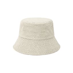 A dual-material reversible bucket hat in a light beige colour with a textured finish. It features a logo.