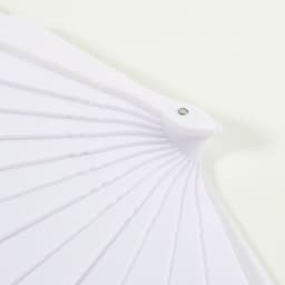 A fabric hand-held fan in white, featuring a simple design with ribbed detailing and a decorative hinge.