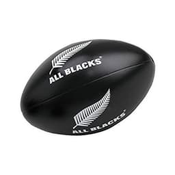A black stress Australian football featuring a fern logo. The product is soft and rounded, designed for squeezing.