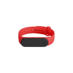A red wristband with a black rectangular feature and a logo, made from flexible material.
