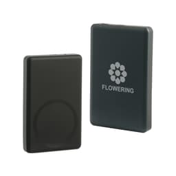 A black aluminium power bank with a circular magnetic area, featuring a logo on one side.