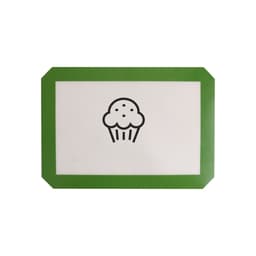 A silicone baking mat with a white surface and a green border featuring a cupcake design in the centre.