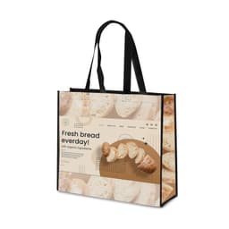 A laminated non-woven trade show bag featuring a design with bread and earthy tones, complemented by black handles.