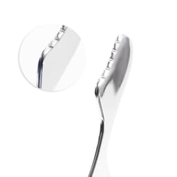 A metallic massage tool with a sleek design and textured grip for handling. Includes a close-up view of the edge.