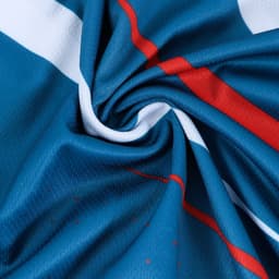 A close-up of blue fabric featuring red and white stripes, showcasing the texture of a polyester sports polo.