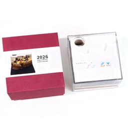 A 3D paper carving notepad with a clear exterior, featuring a manual on top, alongside a red box.