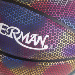 A holographic basketball with a vibrant multicoloured pattern and a logo on its surface.