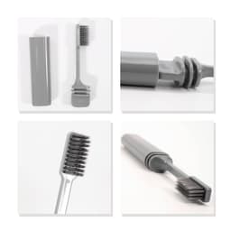 A foldable toothbrush in grey, showcasing its compact design and storage case. Features a brush head and handle.