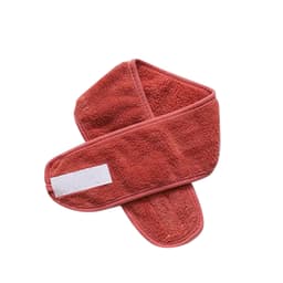 A promotional headband in a coral colour, featuring a soft, textured fabric and a logo.