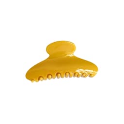 A yellow acetate hair clip with a smooth finish and multiple gripping prongs.