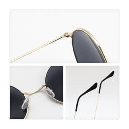 Retro round sunglasses with black lenses and a gold frame, featuring clear nose pads and sleek black arms.