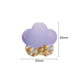 A flower-shaped sticky note in pastel purple with a design of gold and white bubbles at the bottom.