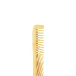 A mixed-tooth bamboo comb in a natural light brown shade with a smooth finish and a slight curve.