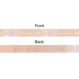 A satin ribbon in soft pink with a subtle sheen, featuring a front and back side. It has a brand logo on one side.