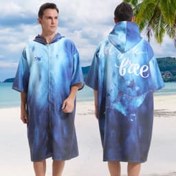 A hooded change towel in blue gradient with a zip, featuring a design on the back and a logo. Suitable for leisure use.