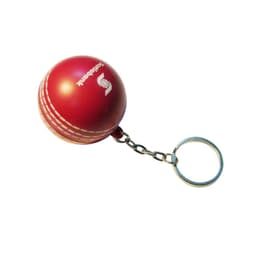A red cricket ball stress reliever attached to a metal keyring, featuring a logo on its surface.