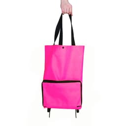A bright pink collapsible shopping trolley bag with black accents and a front pocket, held by a hand.