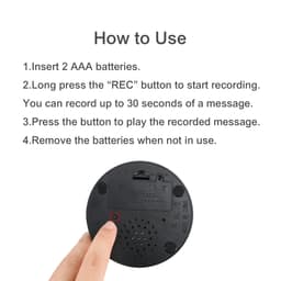 A round black voice recording button with a small speaker and a button for recording messages.
