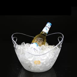 A clear ice bucket filled with ice and a bottle resting on top, featuring a handle for easy carrying.