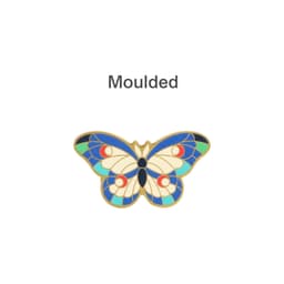 A moulded metal clip featuring a vibrant butterfly design with blue, green, red, and cream colours.