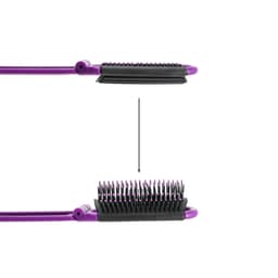A folding hair brush in purple with black bristles, featuring a built-in mirror and a compact design.