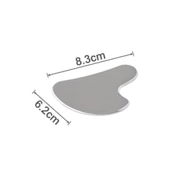 A stainless steel Gua Sha massage tool with a smooth, shiny surface, measuring 8.3cm by 6.2cm.