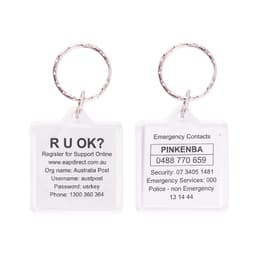 A square acrylic keyring in clear colour featuring emergency contact information on both sides.