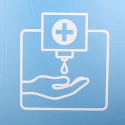 A graphic of a hand under a dispenser, with a droplet falling from a medical cross symbol. Predominantly blue background.