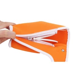 An orange bottle cooler with a zip closure, featuring a white trim and a hand holding it.