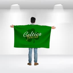 A person wearing a large green flag with a logo and text on the back, standing in a well-lit space.
